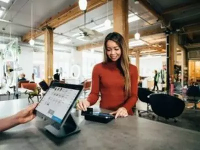 Customer at the counter with a computer